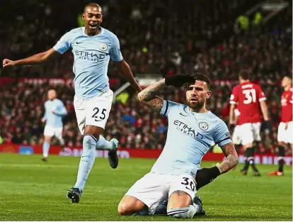  ?? — AP ?? Salute him: Manchester City’s Nicolas Otamendi celebratin­g after scoring the second goal against Manchester United in the English Premier League match at Old Trafford on Sunday. City won 2-1.