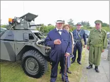  ??  ?? Do you think that's wise, sir? Left to right: Alex Wright as Sir Winston Churchill, Kneale Smith as Corporal Jones, Willie Munro as Warden Hodges and Jim Watson as Captain Mainwaring, alongside Seil's own 1959 Daimler 'Ferret' Scout, equipped with a...