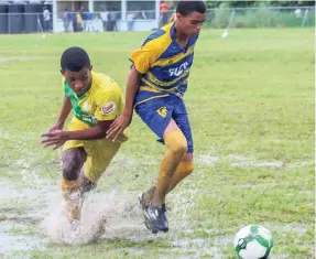  ?? FILE ?? Ruseas High’s Renaldo Wellington (right) dribbles the ball away from Knockalva High’s Lamar Wright during their ISSA/FLOW daCosta Cup match at Rusea’s on Wednesday, October 4, 2017.