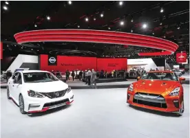  ?? — AP ?? DETROIT: A Nissan Sentra Nismo (left) and a GT-R are shown at the North American Internatio­nal Auto Show in Detroit on Monday.