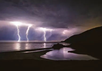  ?? Kodiak Greenwood / Special to The Chronicle 2020 ?? Lightning strikes along the central coast of California near Little Sur River in Los Padres National Forest in 2020.