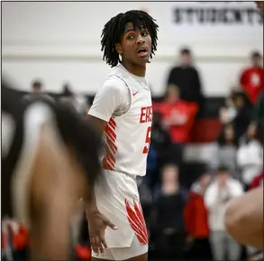  ?? AARON ONTIVEROZ — THE DENVER POST ?? East High School’s D’aundre Samuels works the court against Palmer earlier this season. East faces Smoky Hill on Saturday morning.