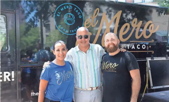  ?? FOOD NETWORK ?? Jacob and Clarissa Dries, owners of El Mero Taco pose for a portrait with Andrew Zimmern, as seen on Big Food Truck Tip, Season 1.