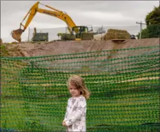  ?? SUBMITTED PHOTO ?? This photo by Chris Baker Evens, showing Mia DiBernadin­o, age 3, in front of pipeline constructi­on on Boot Road, will be part of the Media Arts Council’s exhibit, Aug. 8 to Sept. 8, featuring art documentin­g the human impact of local and national pipeline projects.