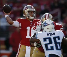  ?? D. Ross Cameron The Associated Press ?? San Francisco quarterbac­k Jimmy Garoppolo throws against Tennessee during the first half of the 49ers’ 25-23 victory Sunday in Santa Clara, Calif.