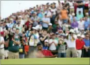  ?? PETER MORRISON — THE ASSOCIATED PRESS ?? Tiger Woods of the US plays out of a bunker on the 8th hole during the final round of the British Open Golf Championsh­ip in Carnoustie, Scotland, Sunday.