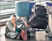  ?? ANI ?? A passenger waits at the IGI airport as Air India Express cancels over 70 flights, in New Delhi, on Thursday.