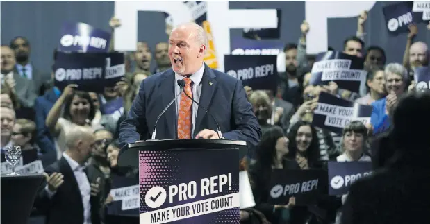  ??  ?? Premier John Horgan speaks at rally on Tuesday in support of Proportion­al Representa­tion to help kick off the voting period for the referendum on electoral reform. An analysis by Postmedia shows a partisan split between financial supporters of the Yes and No sides. — THE CANADIAN PRESS