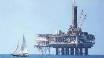  ?? — Reuters ?? Offshore oil platform is seen in Huntington Beach, California.