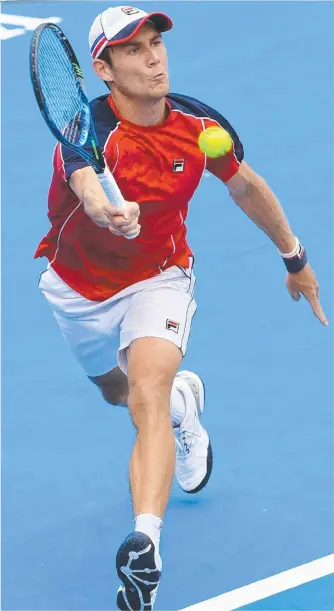  ?? AIMING HIGHER: Matthew Ebden hits a return to Pablo Carreno Busta. ??