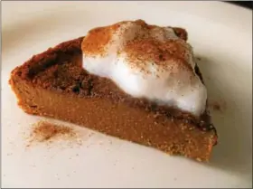  ?? PHOTO BY JIM BAILEY ?? Indian Pudding Pie with Cinnamon-Milk Foam is shown.