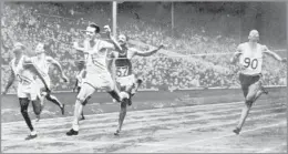  ?? Associated Press ?? CELEBRATED OLYMPIAN
Cliff Bourland, second from left, placed fifth in the 200 meters at the 1948 London Games, above, but the USC champ took the gold in the 1,600-meter relay.