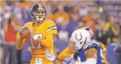  ?? DARRON CUMMINGS/ASSOCIATED PRESS FILE PHOTO ?? Broncos quarterbac­k Brock Osweiler sparked a 25-13 comeback over the Colts on Thursday with a touchdown run and two TD passes while completing 12 of 17 throws for 194 yards.