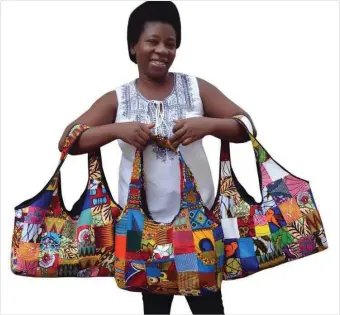  ??  ?? Adebowale displaying her bags