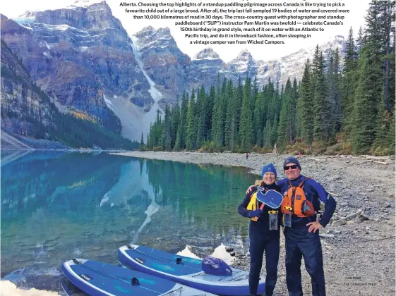  ?? JODI BOYD THE CANADIAN PRESS ?? Pam and John braced -8 C temperatur­es and 8 C water to enjoy the classic Rockies setting at Moraine Lake, Alberta. Choosing the top highlights of a standup paddling pilgrimage across Canada is like trying to pick a favourite child out of a large brood....