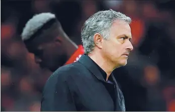  ?? REUTERS FILE ?? Manchester United on Tuesday fired Jose Mourinho as its manager after a run of poor results and reports of dressing-room unrest, including a falling-out with star midfielder Paul Pogba (background).