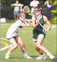  ?? John Nash / Greens Farms Academy ?? Sacred Heart Greenwich’s Kathryn Keller, right, looks to get around Greens Farms Academy’s Ella Murphy.