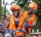  ?? ?? Butundu’s husband was against her becoming a boda boda driver and refused to teach her to ride so she asked other drivers to show her. Photograph: Courtesy of SafeBoda the world, recommende­d reads, and thoughts from our team on key developmen­t and human rights issues, delivered to your inbox every two weeks: