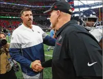  ?? CURTIS COMPTON / CCOMPTON@AJC.COM ?? Titans coach Mike Vrabel (left) and Falcons coach Dan Quinn shake hands after Atlanta’s Sept. 29 home loss. Not everyone thinks the custom will fade.