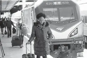  ?? Nicolaus Czarnecki, Boston Herald ?? Passengers from Washington arrive at South Station in Boston in March 2020.