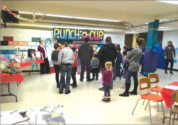  ?? TOWNSHIPPE­RS’ ASSOCIATIO­N ?? With bight colours and exciting prizes, the Punch-a-cup was one of the popular activities at the Heroes’ Memorial School playground fundraiser on February 24.