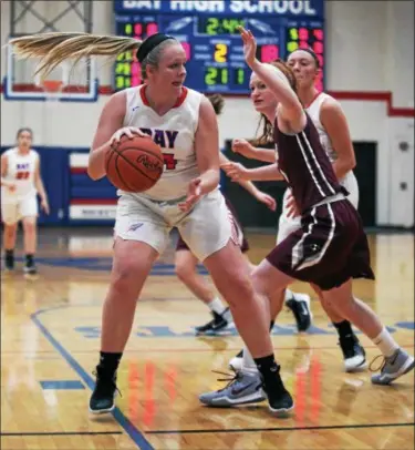  ?? RANDY MEYERS — THE MORNING JOURNAL ?? Bay’s Halle Orr catches the ball in the low post as Rachel Moeller of Rocky River defends during the second quarter.