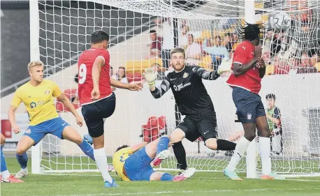  ??  ?? York City score against Sunderland as Lee Burge is unable to keep the ball out of the net.