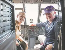  ?? ?? Eileen Donovan and her father J. Patrick Donovan Sr. inside the cockpit of the helicopter they both flew — he on April 21, 1969, and she on April 21, 2010. It is now in the Steven F. Udvar-Hazy Center, the Smithsonia­n National Air and Space Museum’s annex at Washington Dulles Internatio­nal Airport.