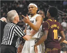  ?? Ethan Miller / Getty Images ?? An official has to separate Colorado’s George King and ASU’s Shannon Evans II during a contentiou­s end to the game.