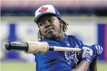  ??  ?? Vladimir Guerrero Jr. was so impressive as a young teenager that the Toronto Blue Jays’ front office was willing to trade prospects and spend the team’s entire internatio­nal bonus budget to sign him.