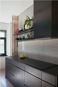  ??  ?? LEFT the matte countertop­s are neolith nero and the floor runner is hill mohair by bofred
RIGHT
barq joinery was behind the home’s seamless storage, which extends to the kitchen