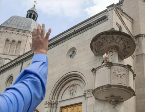  ?? Steph Chambers/Post-Gazette ?? Bishop Mark E. Brennan waves to attendees after his installati­on on Aug. 22, 2019, as bishop of the Diocese of WheelingCh­arleston, W.Va., at the Cathedral of St. Joseph in Wheeling, W.Va.