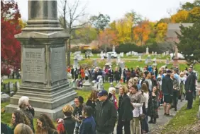  ?? PHOTO BY KATHERINE TAYLOR/THE NEW YORK TIMES ?? A line of people at Mount Hope Cemetery wait to visit the grave of Susan B. Anthony, a women’s suffrage pioneer, on Election Day in Rochester, N.Y. The cemetery opened early and was to stay open late. The line grew throughout the day and by noon it had...