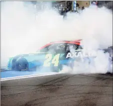  ?? Michael Reaves / Getty Images ?? William Byron, driver of the No. 24 Axalta Chevrolet, celebrates with a burnout after winning the NASCAR Cup Series Dixie Vodka 400 at Homestead-Miami Speedway on Sunday in Homestead, Fla.