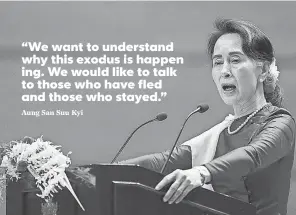  ?? AP ?? Myanmar’s State Counselor Aung San Suu Kyi delivers a speech to the nation at the Myanmar Internatio­nal Convention Center.