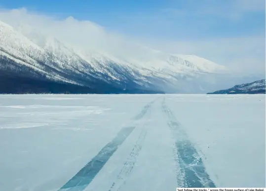  ??  ?? ‘Just follow the tracks..’ across the frozen surface of Lake Baikal.