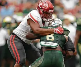  ?? Chris O’Meara / Associated Press ?? Dominant defensive linemen like Houston’s Ed Oliver are few and far between in college football these days as the balance of power has swung toward the offenses.