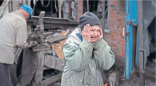  ?? ?? NEW DIMENSION: Valentina Bondarenko, aged 78, outside her ruined home after a Russian missile strike in Sloviansk, Ukraine.