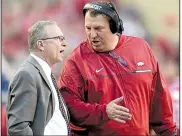  ?? NWA Democrat-Gazette file photo ?? Arkansas football Coach Bret Bielema (right) talks with UA Athletic Director Jeff Long on the sideline during the Razorbacks’ 2016 game against Alabama at Reynolds Razorback Stadium in Fayettevil­le. Long was fired as athletic director Wednesday.