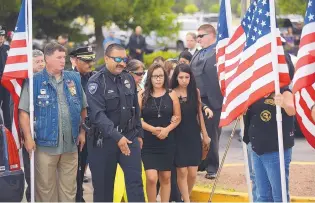  ??  ?? Relatives of fallen Hatch police officer Jose Chavez enter the Pan American Center on Sunday. Chavez was killed Aug. 12 during a traffic stop.