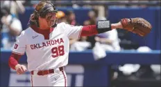  ?? NATE BILLINGSAP ?? OKLAHOMA PITCHER JORDYN BAHL celebrates after a strikeout against Tennessee in a Women’s College World Series game on Saturday in Oklahoma City.