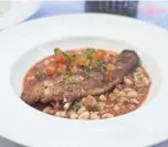  ?? JENNIFER CHANDLER ?? Creole lake’s Catfsh over Hoppin’ John at Felicia Suzanne’s restaurant in Downtown Memphis.