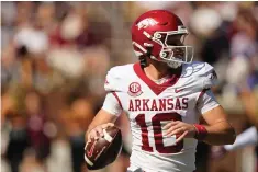  ?? The Associated Press ?? ■ Arkansas quarterbac­k Cade Fortin (10) sets up to pass against Mississipp­i State Saturday in Starkville, Miss.