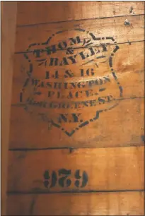  ??  ?? The Kolfages found this “Thom & Bayley” company logo that was upside-down under the cedar lapping on the original outer walls during renovation work. “We found stenciling on the boards (in the walls) they said. It was for a hat maker in New York City. The address on it still exists in lower Manhattan.”