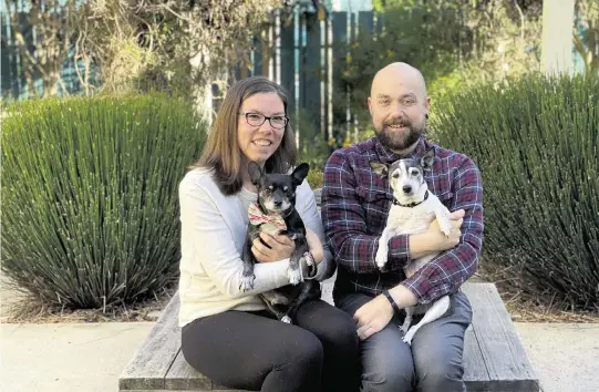  ?? Courtesy of Peace of Mind Dog Rescue ?? Alison Day and husband Steve Gross are pictured with Moose and Boudreaux, two of the senior dogs they have cared for.