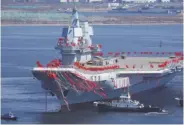  ?? AFP / Getty Images ?? China’s home-built aircraft carrier may need three or so years before it is fully equipped and tested.