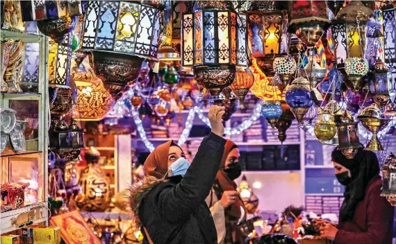  ?? AFP ?? Colorful lanterns and ornate Ramadan decoration­s filled the streets of Jerusalem as Palestinia­ns prepared for a holy month freer of COVID-19 restrictio­ns than at the height of the pandemic.