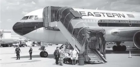  ??  ?? This Eastern airplane was chartered by Holland America cruise line to carry passengers from the Zaandam and Rotterdam ships to Atlanta on April 3.