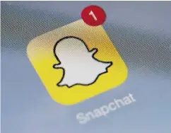  ?? LIONEL BONAVENTUR­E / AFP / GETTY IMAGES ?? The app Snapchat was used by a group of Nova Scotia boys to obtain nude photos of girls as young as 13.