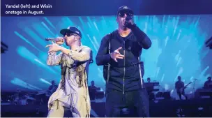  ?? ?? Yandel (left) and Wisin onstage in August.